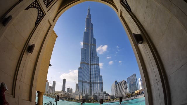 The Burj Khalifa towering over the Dubai skyline at dusk